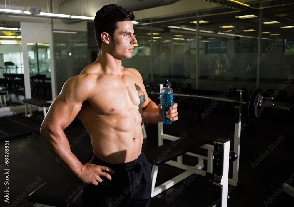 Muscular man holding energy drink Muscular man holding energy drink