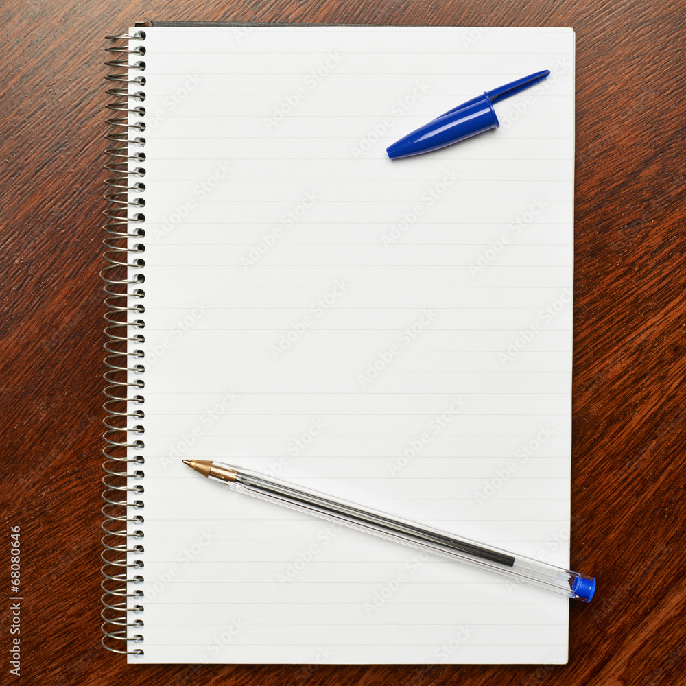 Lined note book over the table Lined note book over the table