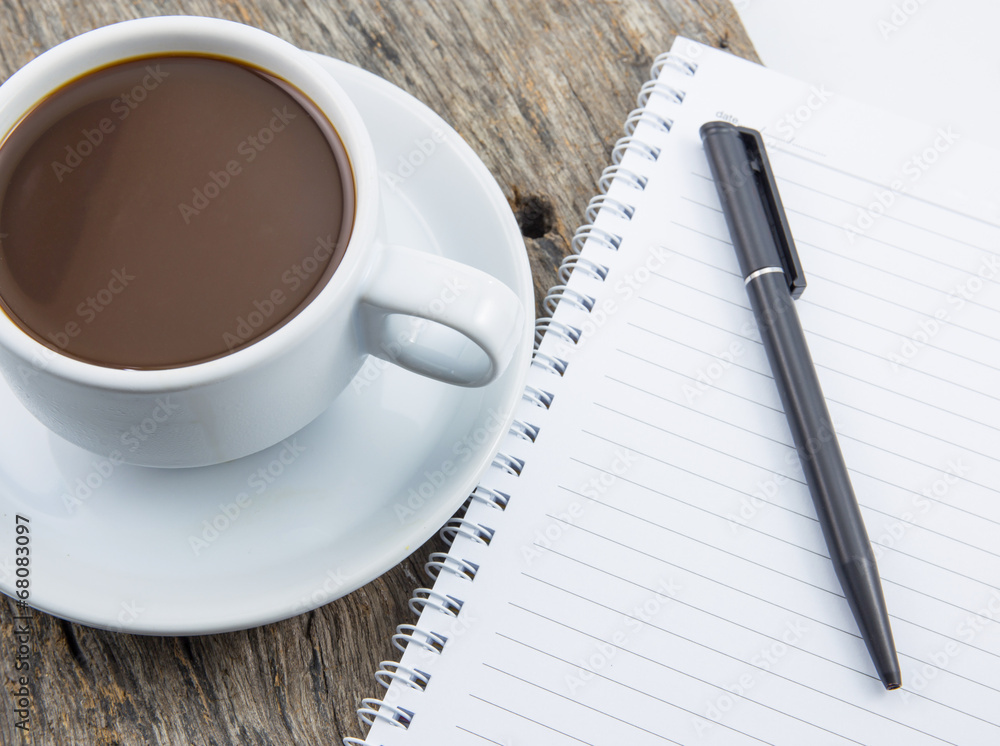 Cup of coffee, note, on wooden table Cup of coffee, note, on wooden table