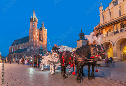 Carriages before the Sukiennice on The Main Market in Krakow photo