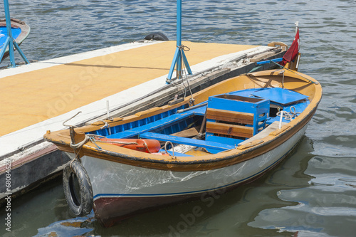 Small wooden motor boat moored up © Paul Vinten