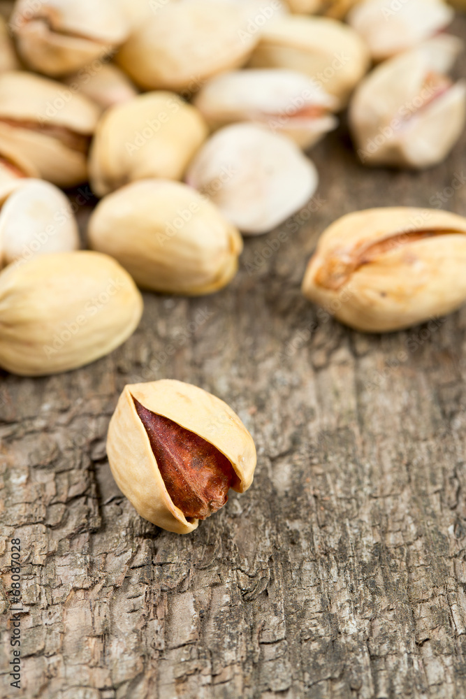 pistachio on wooden surface pistachio on wooden surface