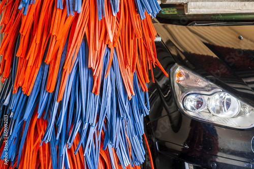 Automatic car wash, red and blue brushe.