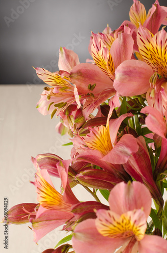 Bouquet of a beautiful alstroemeria flowers on wood