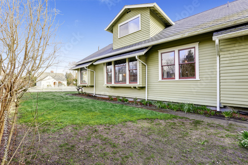 Backyard with flower bed during early spring.