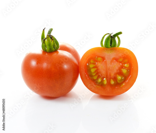 Red tomato vegetable on white background.