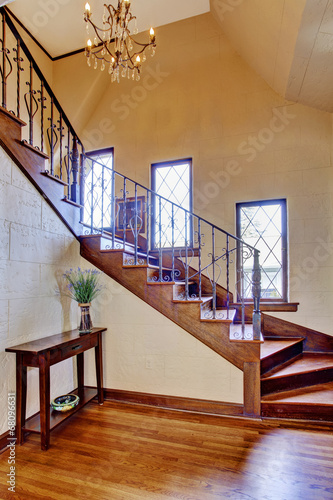 Luxury house interior. Entrance hallway with staircase