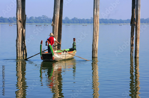 Local man in a boat near U Bein Bridge, Amarapura, Myanmar © donyanedomam