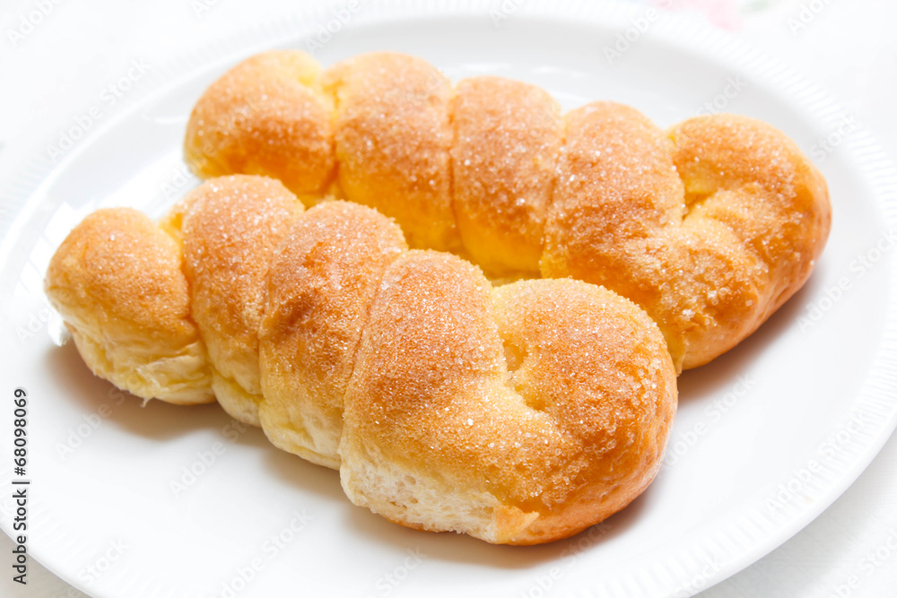 Sweet buns with butter and sugar.