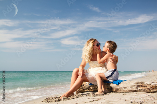 Mom son and the moon on the sea