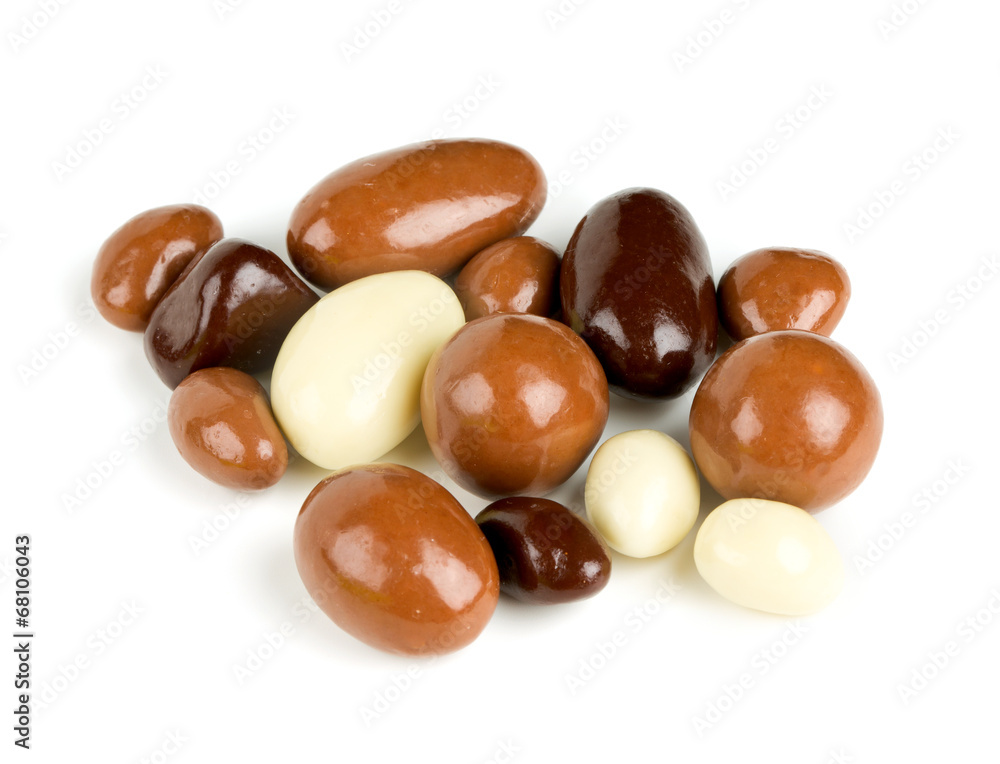 chocolate covered nuts and raisins isolated on white chocolate covered nuts and raisins isolated on white