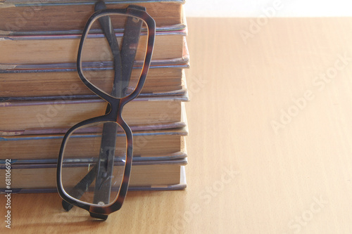 a pile of books and glasses