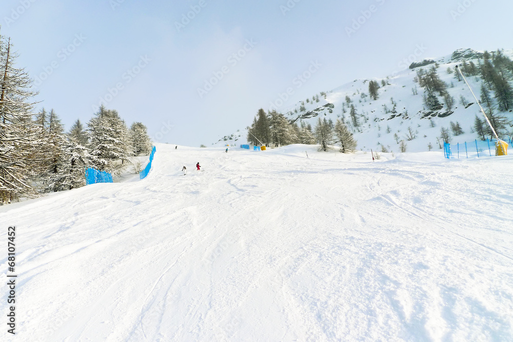 snow ski tracks in skiing area Via Lattea Italy