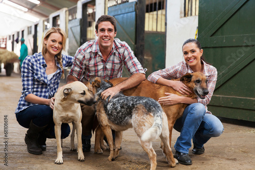 group of farm workers with dogs
