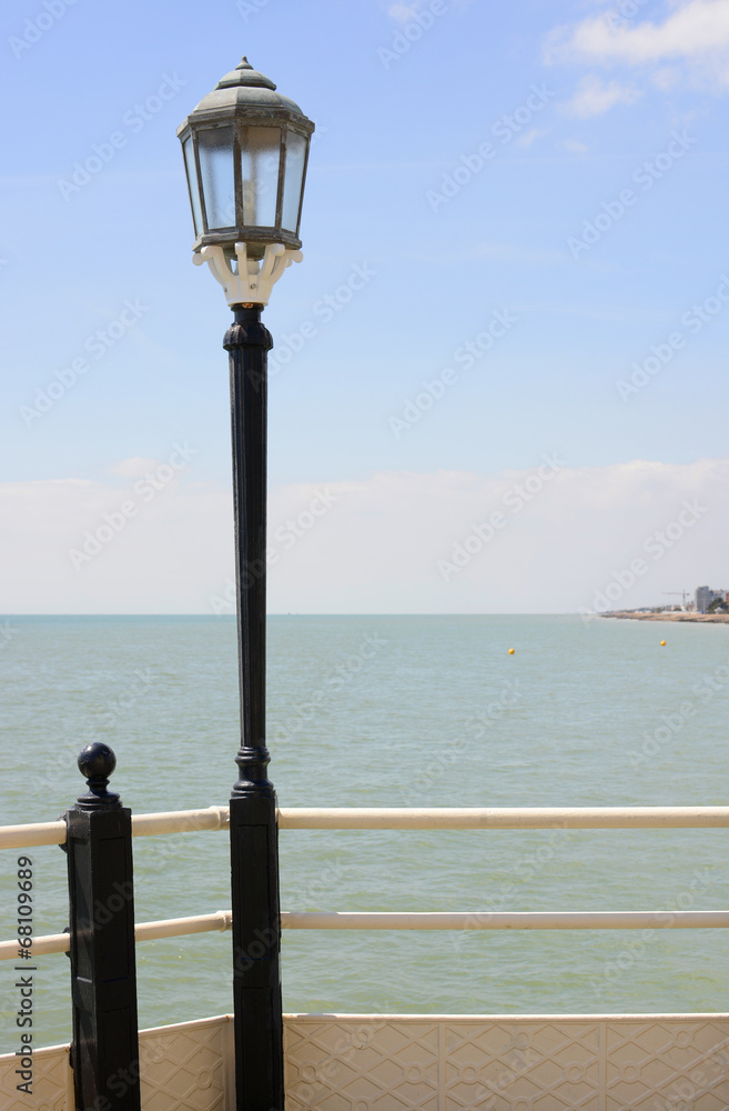 Streetlamp on pier at Worthing. Sussex. England