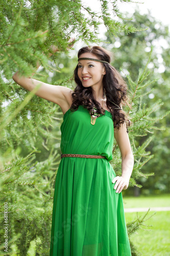 Beautiful young woman in green dress