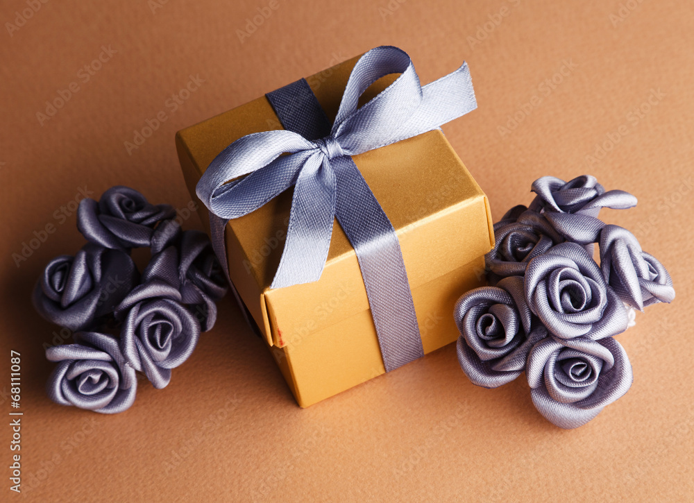 grey flowers and golden gift box - obrazy, fototapety, plakaty 