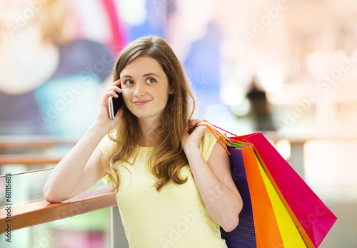 Shopping girl with smartphone