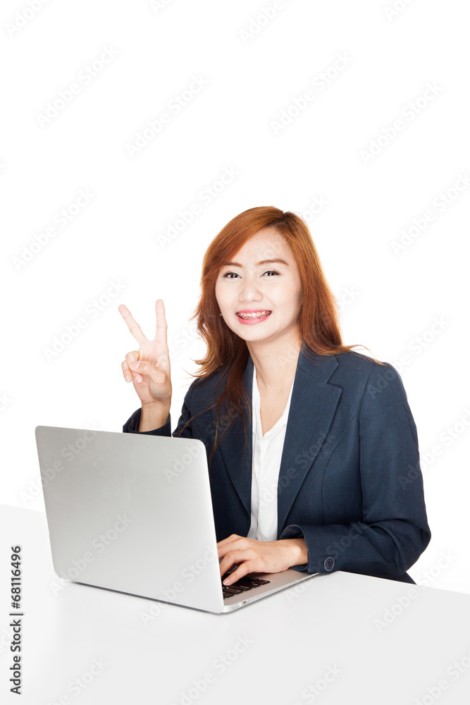 Asian office girl show victory sign with notebook PC Asian office girl show victory sign with notebook PC