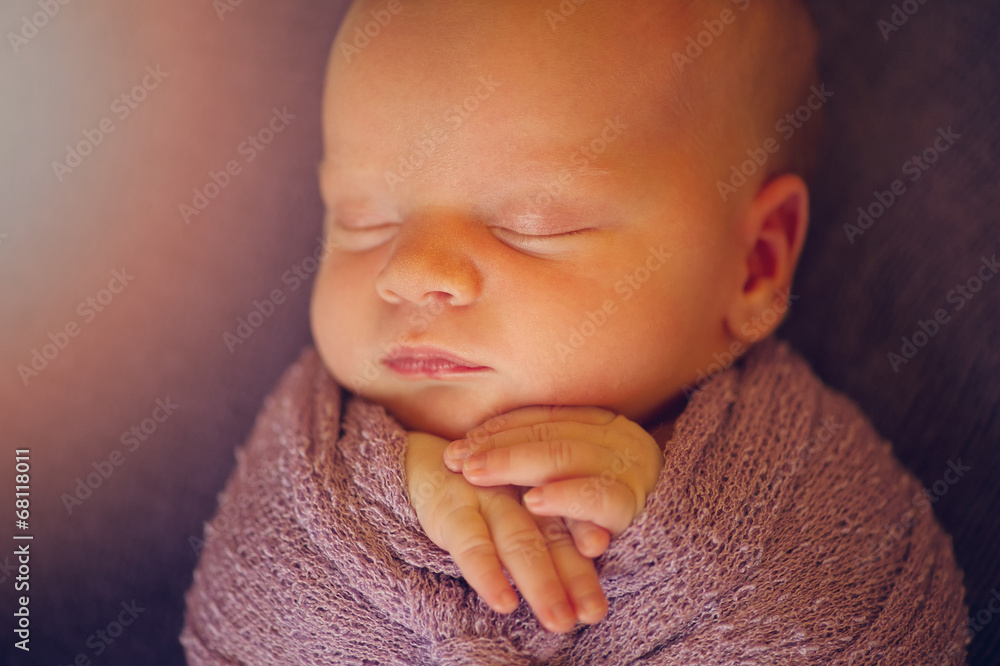 Newborn Baby in Wrap with Hands