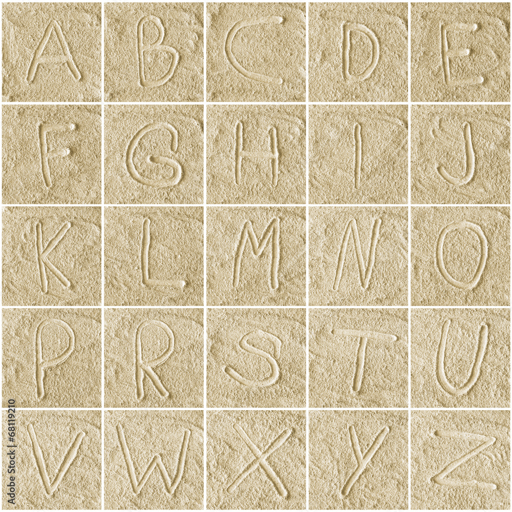 handwritten alphabet letters on sand Stock Photo | Adobe Stock