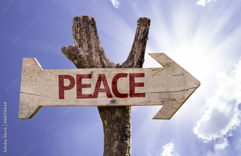 Peace wooden sign on a beautiful day