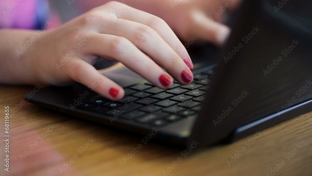 Closeup of woman hands typing on modern laptop Closeup of woman hands typing on modern laptop