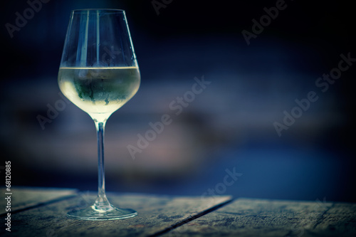 Chilled white wine in a glass , with copy space