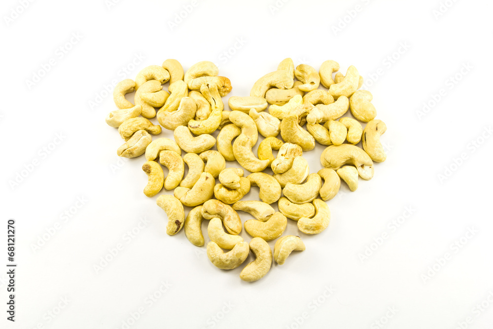 raw cashew nut heart shape on white background raw cashew nut heart shape on white background