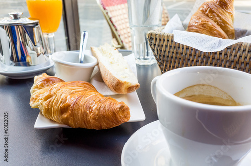 coffee and croissants on table