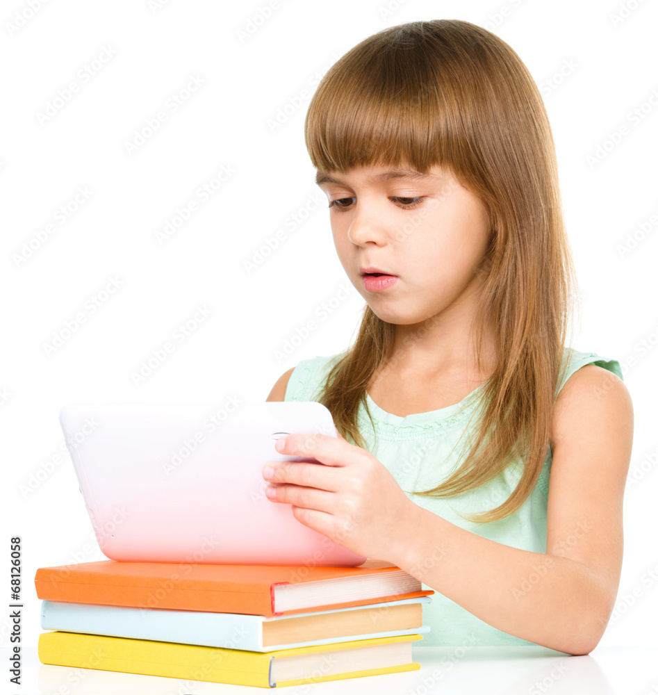 Young girl is using tablet Young girl is using tablet