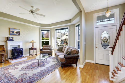 House interior with open floor plan. Living room and entrance ha