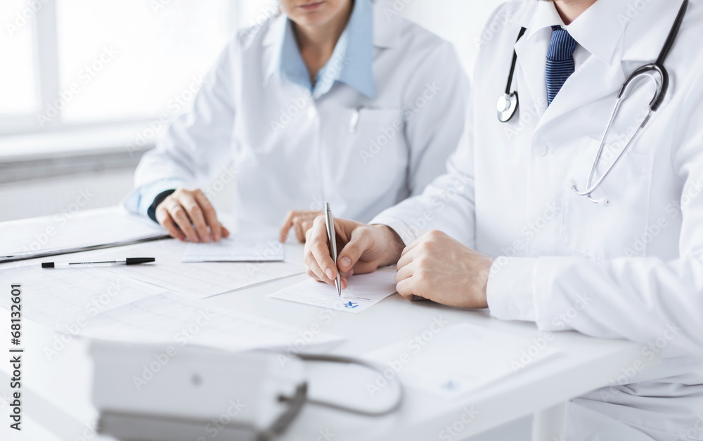 doctor and nurse writing prescription paper doctor and nurse writing prescription paper