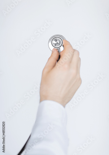 doctor hand with stethoscope listening somebody