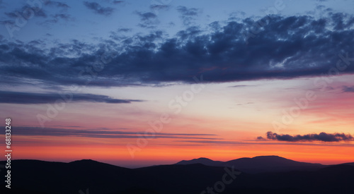 Colorful sunset over the mountain © Aleksey Sagitov