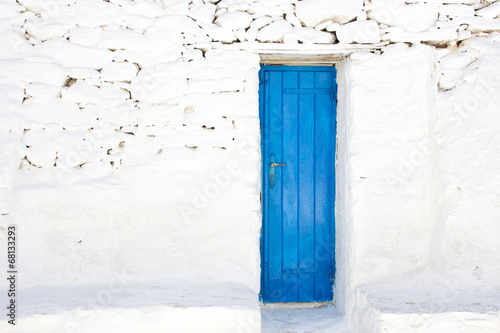 blue door in a greek island of Mykonos © smoxx