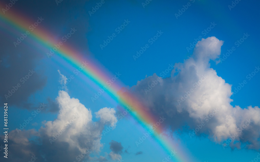 Skyscape view on blue sky with rainbow