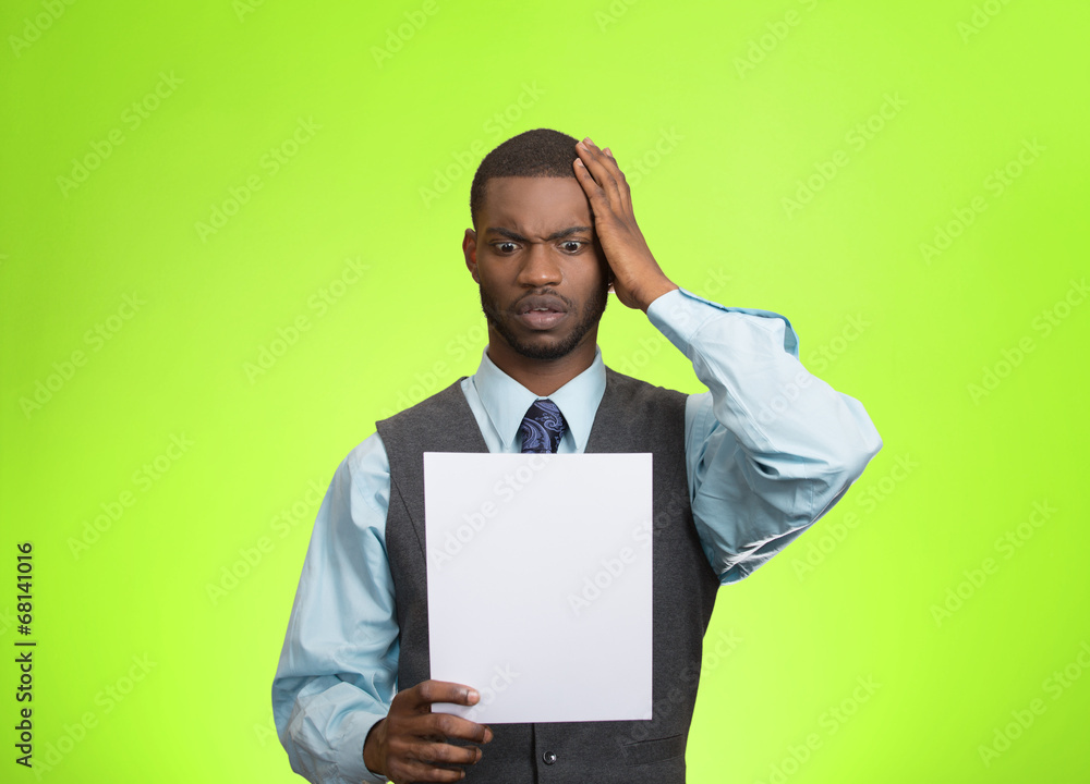 Man holding paper, statement, shocked with bad news Man holding paper, statement, shocked with bad news