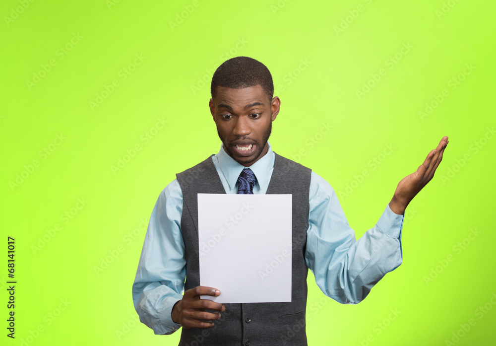 Man holding paper, statement, shocked with bad news Man holding paper, statement, shocked with bad news