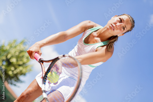 Young woman playing tennis