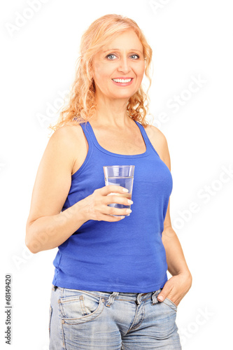 Mature woman holding a glass of water