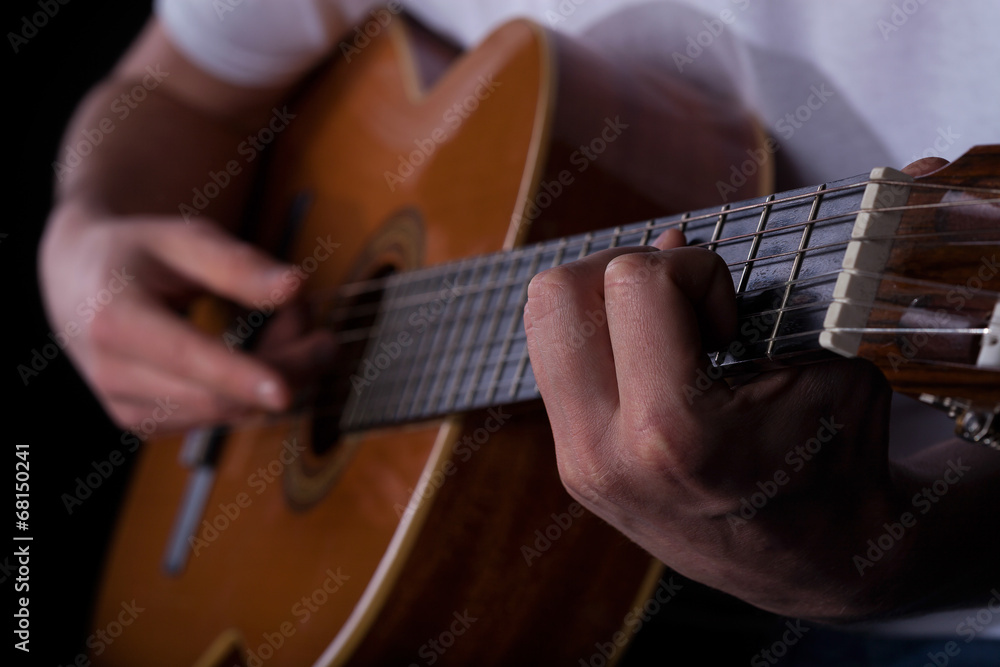 Fototapeta premium Man playing on guitar