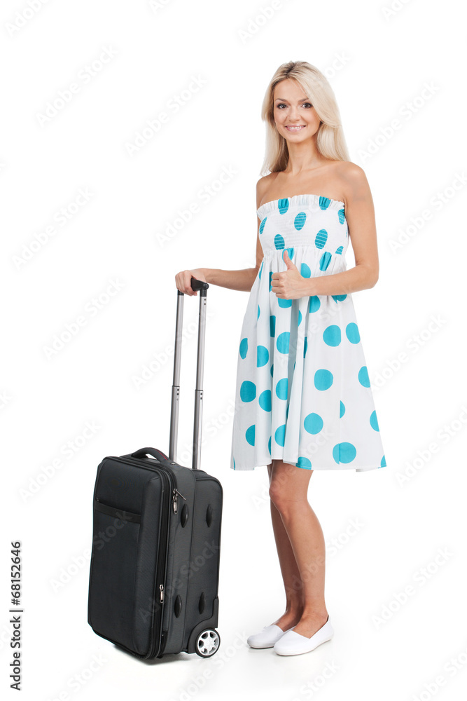 beautiful girl standing with luggage and smiling. beautiful girl standing with luggage and smiling.
