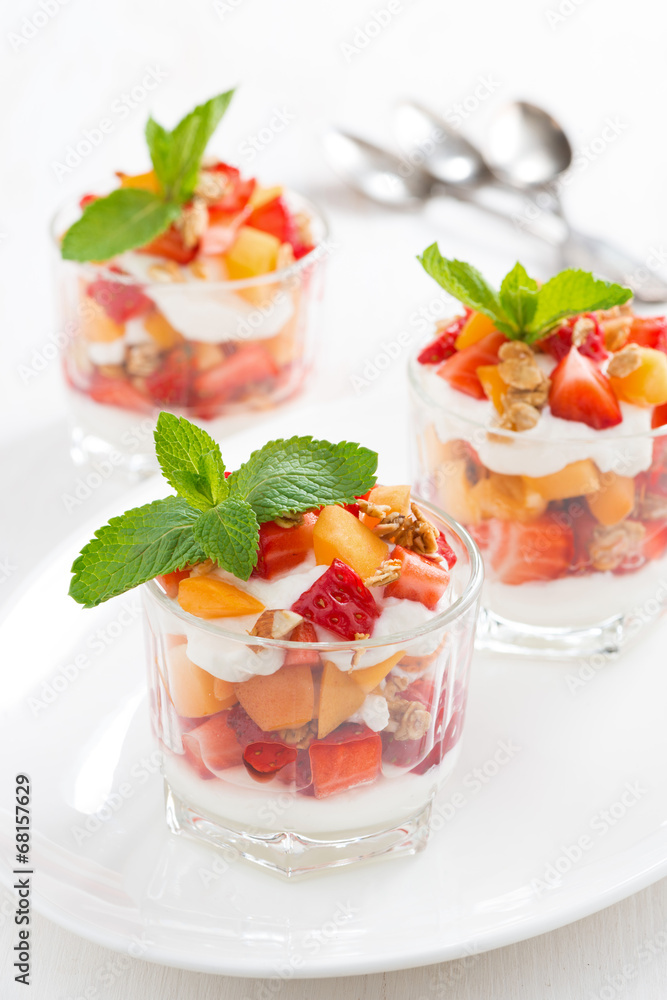 dessert with strawberries, apricots, whipped cream and mint dessert with strawberries, apricots, whipped cream and mint