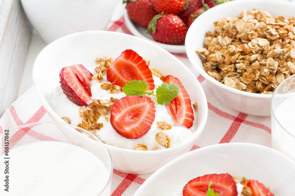 breakfast - yogurt, strawberries, granola and milk, close-up breakfast - yogurt, strawberries, granola and milk, close-up
