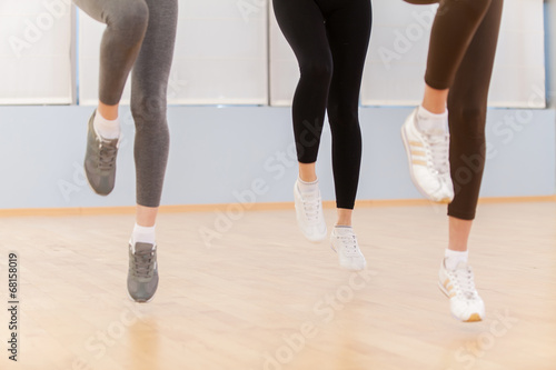 Group Of People Exercising In Dance Studio.