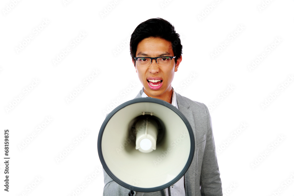 Portrait of angry asian man shouting with megaphone Portrait of angry asian man shouting with megaphone