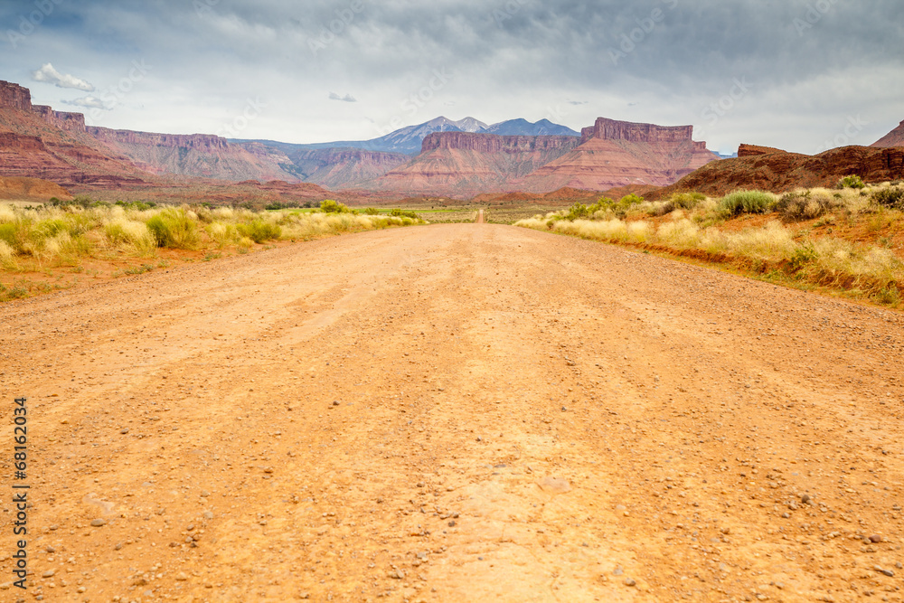 Dirt road through beautiful barren land