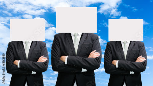 Businessman standing white paper face holding front of head