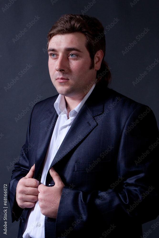 man in a black suit man in a black suit